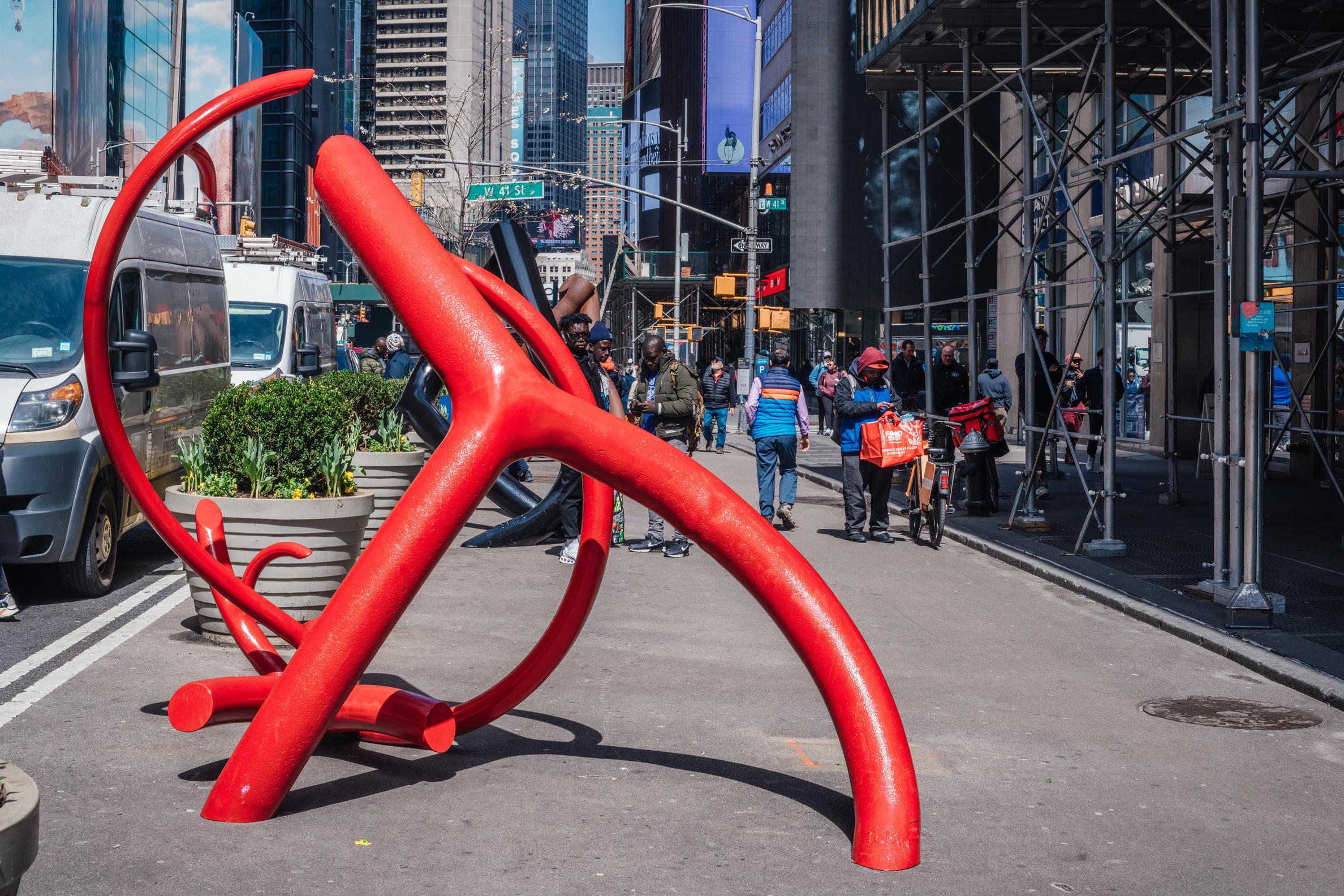 A bright red, but shorter, state with a form evoking a person cradling a baby